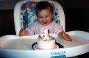 jules smiling at 1st birthday cake